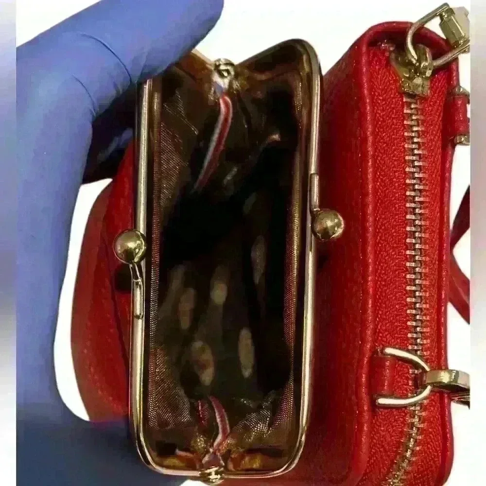 A Forever Young red woman’s,Crossbody bag / wallet with attached iPhone carrier.